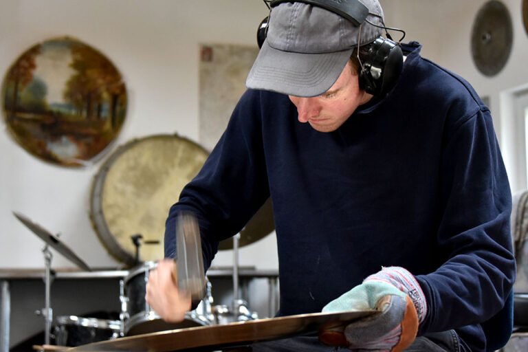 Jesse Simpson at Ateliér 57 making cymbals