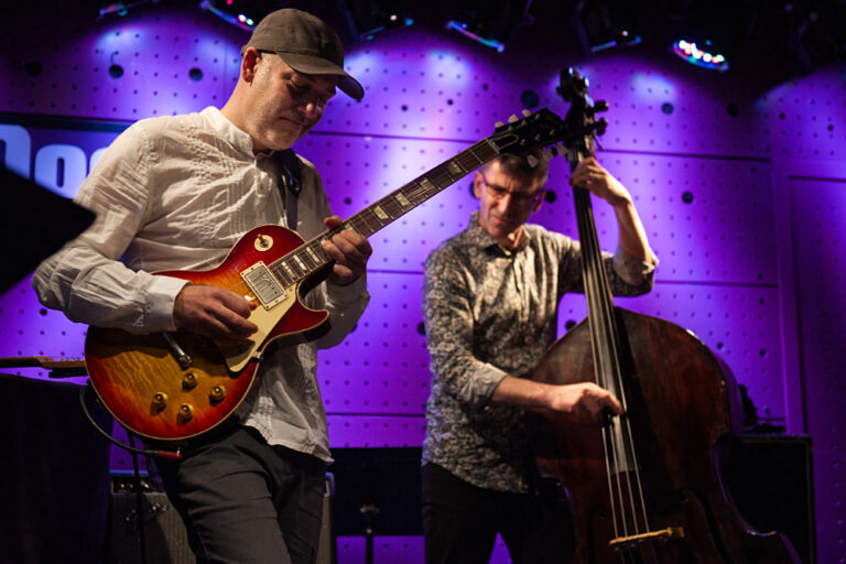 Adam Tvrdý playing jazz guitar on stage during his birthday concert at Jazz Dock, Prague.