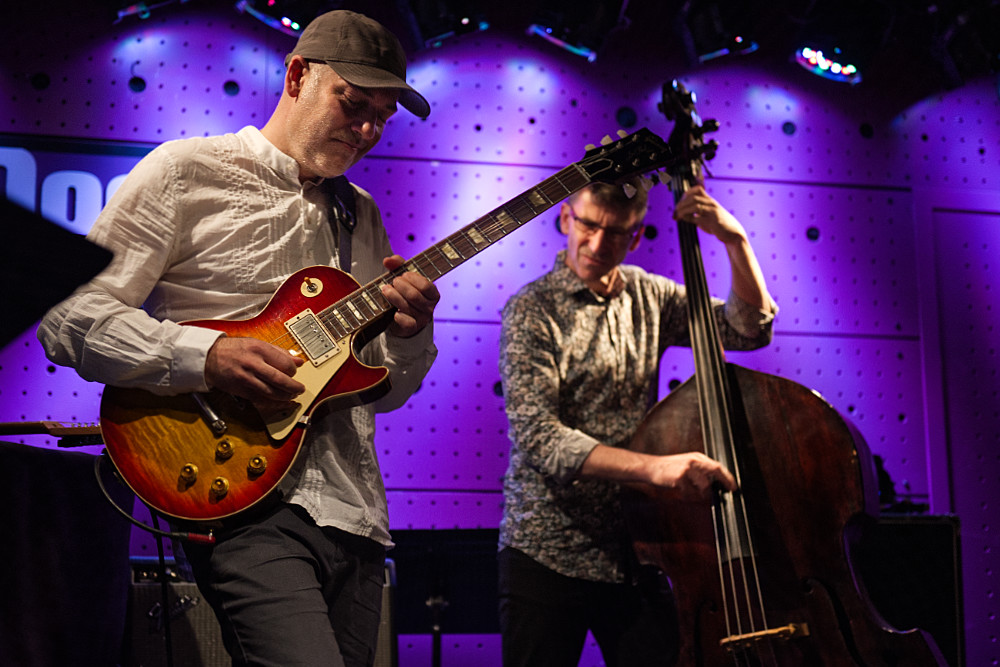 Adam Tvrdý playing jazz guitar on stage during his birthday concert at Jazz Dock, Prague.